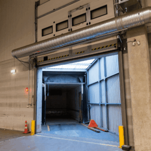 Energy-efficient overhead door in a commercial facility