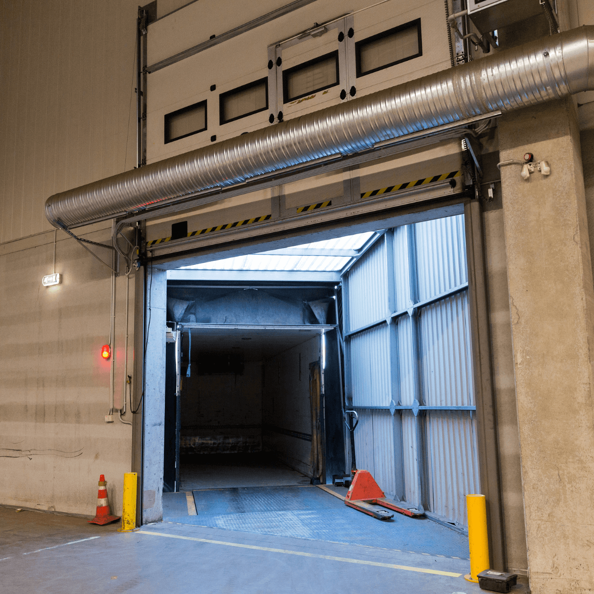 Energy-efficient overhead door in a commercial facility